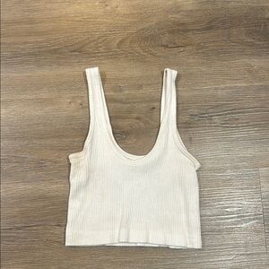 Urban Outfitters Cream Ribbed Sleeveless Crop Tank fits like a small